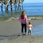mommy and baby holding hands