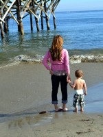 mommy and baby holding hands