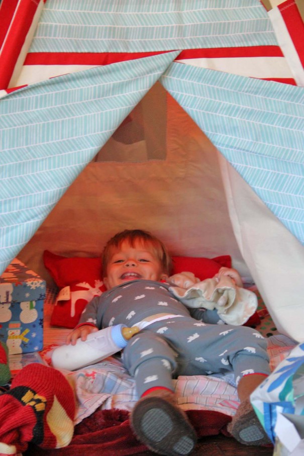 sawyer laughing in teepee