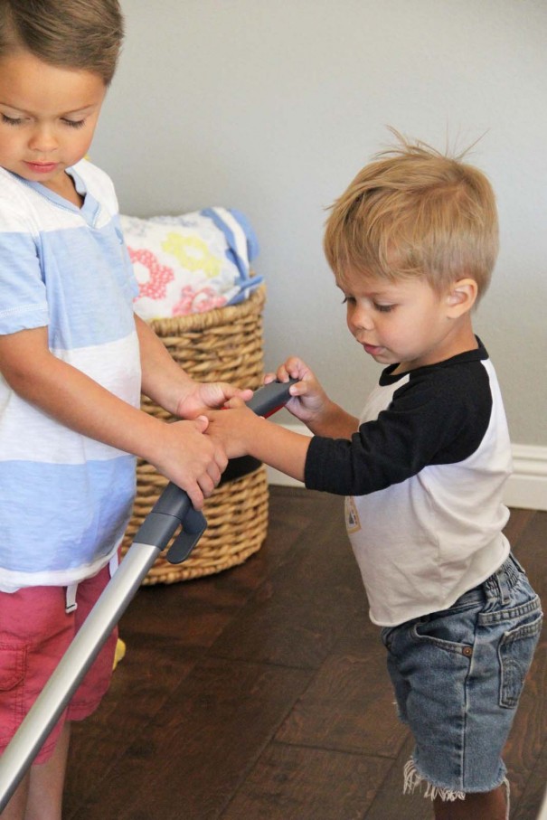 boys vacuuming together